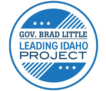 Blue and white circular logo that says Gov. Brad Little Leading Idaho project