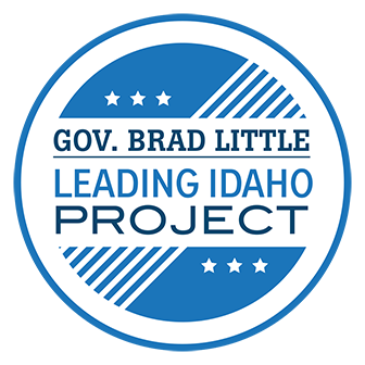 Blue and white circular logo that says Gov. Brad Little Leading Idaho project