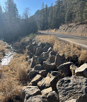 Rock armoring near SH-162 to protect the roadway.