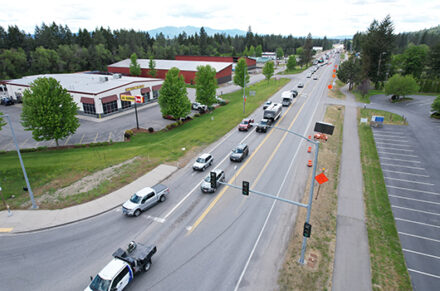 Cars turning a corner at an intersection.