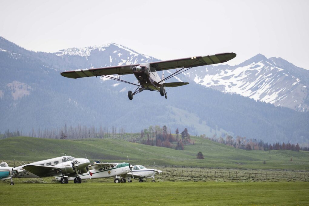 Plane taking off from a backcountry airstrip