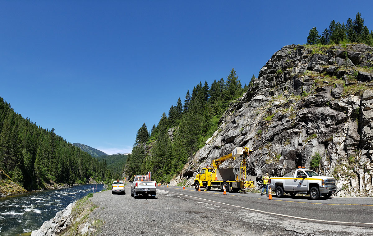 US-12 near Post Office Creek showing a rock wall area with crews conducting preliminary work.