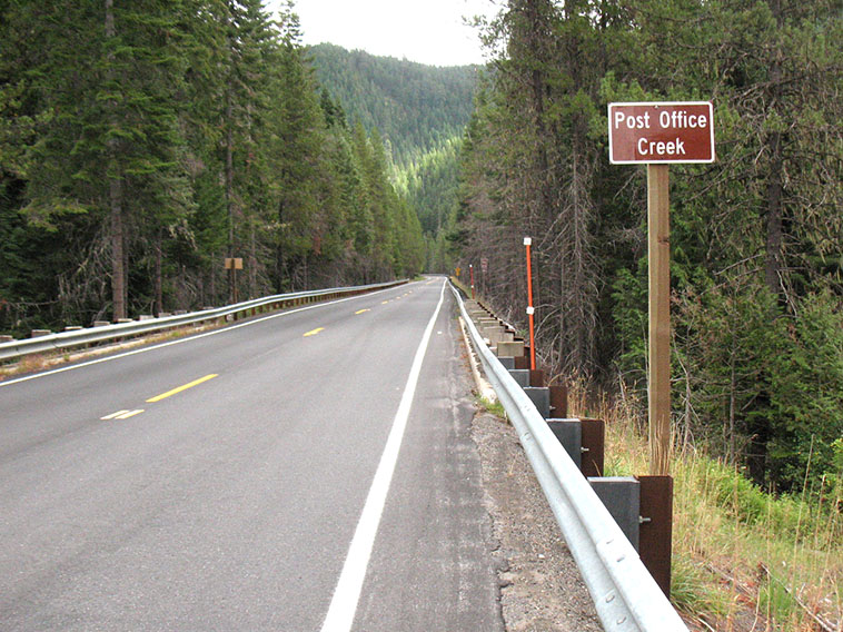 US-12 showing Post Office Creek sign in forested area in Idaho County.
