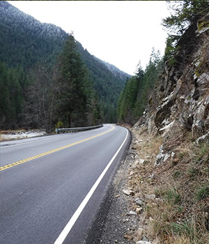 US-12 bordering a rocky edge.