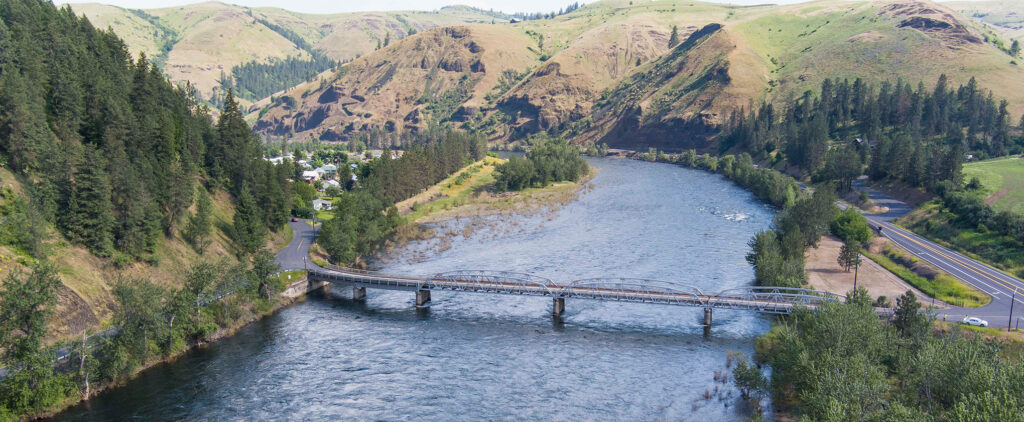 The East Kooskia Bridge over the river can be seen from a large distance away.