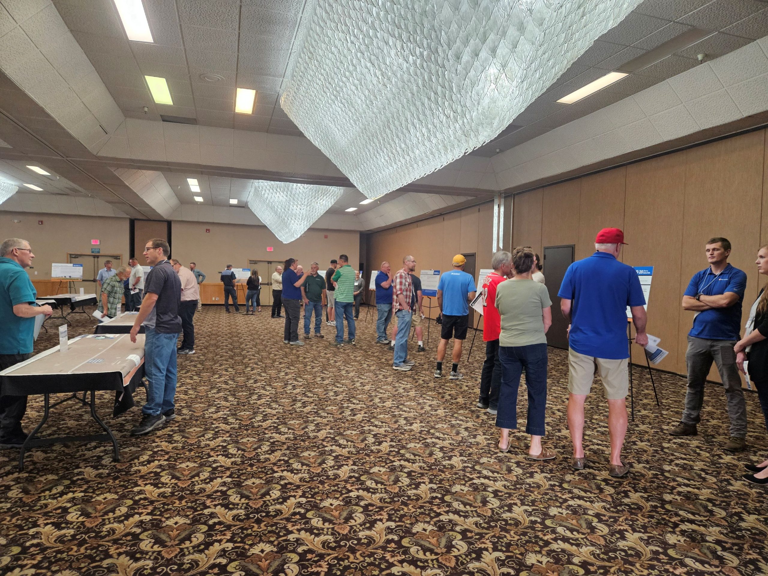 Community members review information at the public meeting.