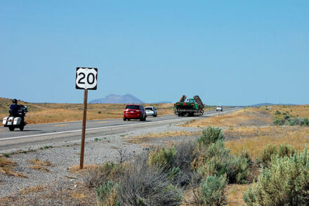Roadside view of US-20 west of Idaho Falls, showing traffic and passing movements in this area where needed improvements will soon be made.