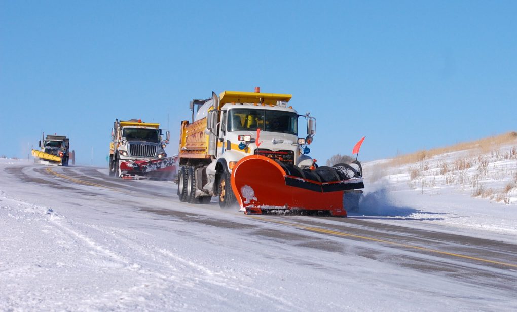 Three snowplows seen from the front