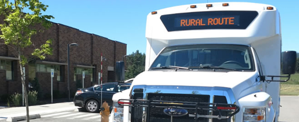 A bus that says "Rural Route" above the driver.