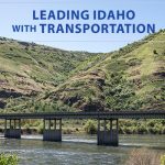 Picture of Spalding Bridge on US-12 and US-95. Text reads Leading Idaho with Transportation. ITD logo reads Idaho Transportation Department and other logo reads Gov. Brad Little Leading Idaho.