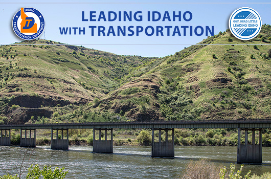 Picture of Spalding Bridge on US-12 and US-95. Text reads Leading Idaho with Transportation. ITD logo reads Idaho Transportation Department and other logo reads Gov. Brad Little Leading Idaho.