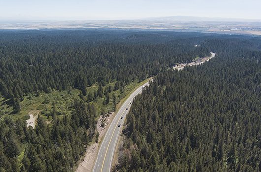 Cars take the highway up a hill in East Idaho
