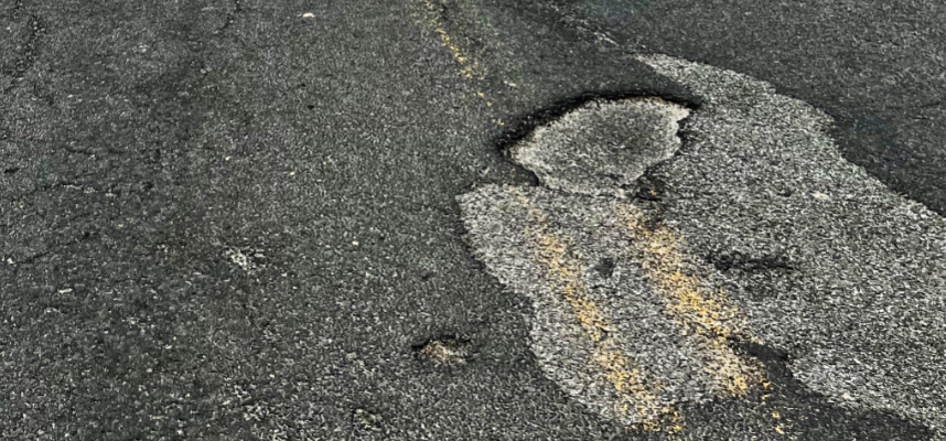 Close up view of a gnarly pot hole on SH-3 near Clarkia.