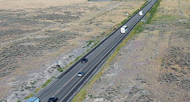 Bus, equipment, commuter and recreational traffic all traveling on US-20 west of Idaho Falls toward the Twin Buttes.