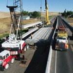 Bridge work using heavy equipment on Thorn Creek Bridge over US-95 near Lewiston, Idaho.