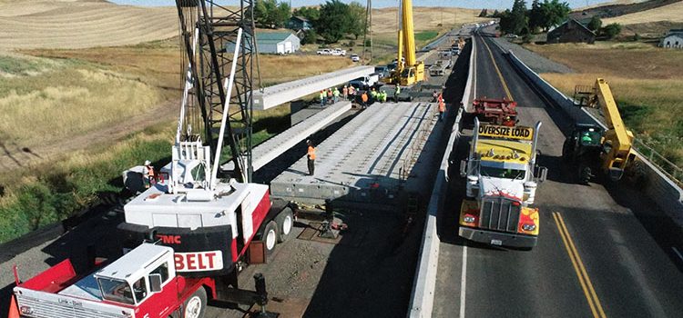 Bridge work using heavy equipment on Thorn Creek Bridge over US-95 near Lewiston, Idaho.
