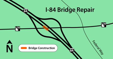 Simplified map showing the location of bridge construction on Interstate 84 near its intersection with U.S. Highway 20 and Federal Way. The construction zone is highlighted in orange along the bridge over I-84. A north arrow and legend label the orange section as "Bridge Construction," and major roads and interchanges are depicted with black lines on a green background.