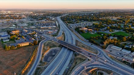 Aerial photo of multi highway intersection at sunset.
