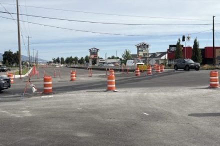 Street view of the SH-41 and Mullan Street intersection showing traffic on the existing lanes, and also the newly constructed lanes where traffic will shift to.