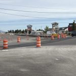 Street view of the SH-41 and Mullan Street intersection showing traffic on the existing lanes, and also the newly constructed lanes where traffic will shift to.