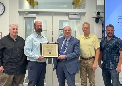IT Engineer Shea McNama receiving a prestigious award from the Bonneville Co. Prosecutor with ITD Executive Leaders.