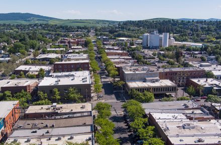 US-95 photo taken with a drone high above the city of Moscow in the spring. The streets, tops of buildings and trees stretch out into the background of picture.