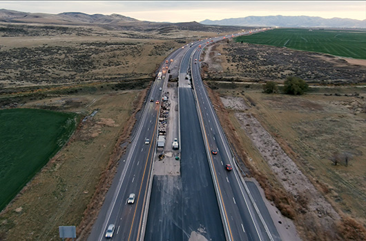 I-15 with construction being conducted on the new lanes between northbound and southbound lanes.