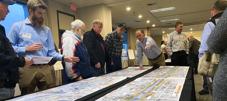 People review a map of a proposed project