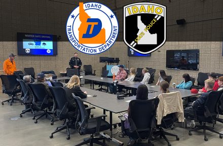 Picture of a ISP trooper and a ITD operator presenting to a classroom and sharing winter driving tips.