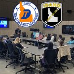 Picture of a ISP trooper and a ITD operator presenting to a classroom and sharing winter driving tips.