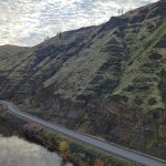 Picture taken from a drone on a cloudy day above US-12 and overlooking the rocky slope by Arrow Bridge.