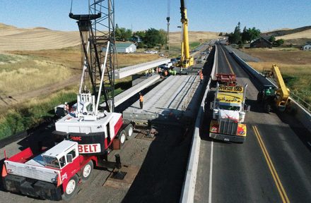 Bridge work using heavy equipment on Thorn Creek Bridge over US-95 near Lewiston, Idaho.