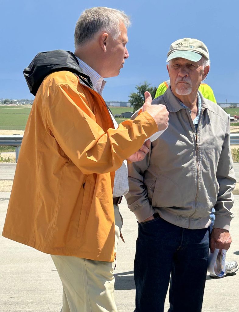 Bob Hoff and Scott Stokes standing together in conversation