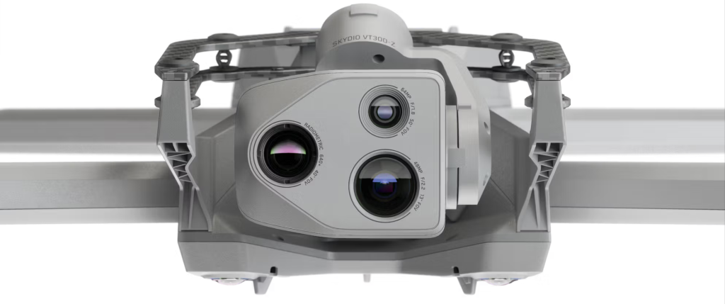 Figure 1. Skydio X-10 - A picture of the grey colored drone that was used with a white background. At least three camera lenses are located on the front of the device.