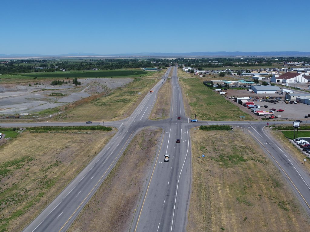 Aerial view of US-20 south of St. Anthony taken in 2023 before construction of a new full interchange at this location.