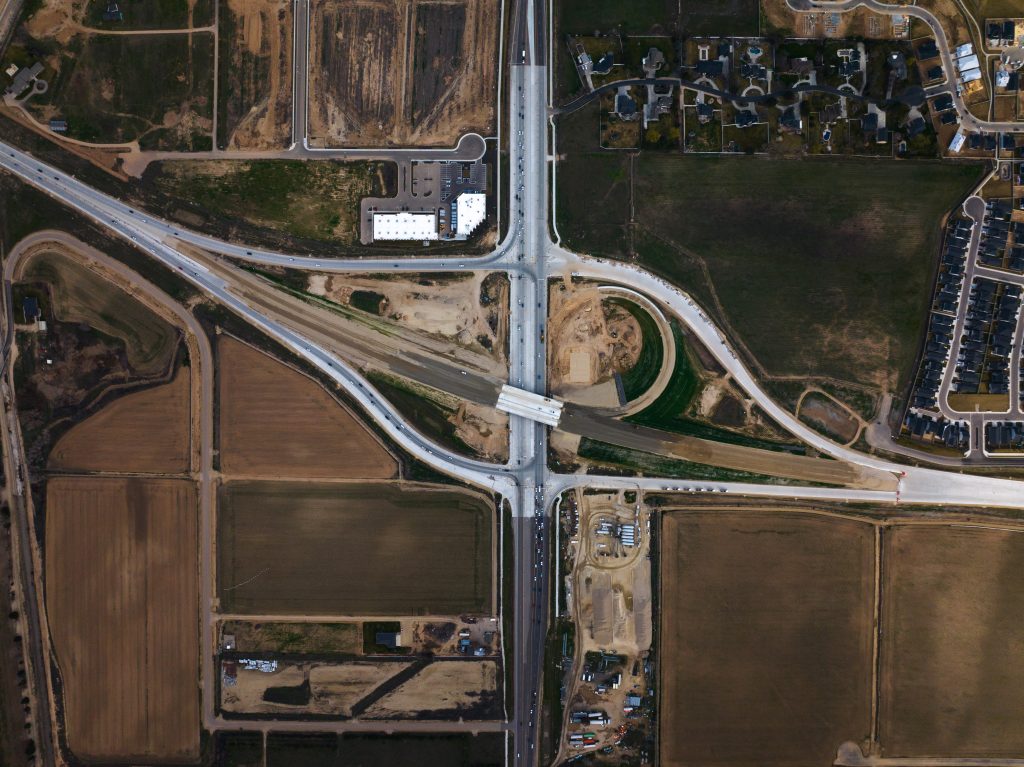 Aerial view of the SH-16/US-20/26 Interchange in March 2026