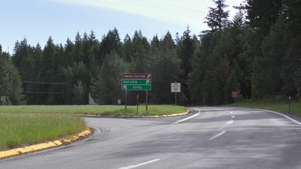 Road sign showing directions to Bayview, Athol and Farragut State Park at the traffic circle on SH-54.