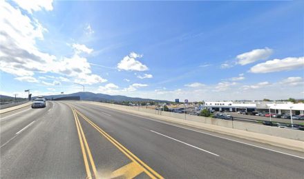Street view of the Greensferry Road overpass rising up and over Interstate 90.