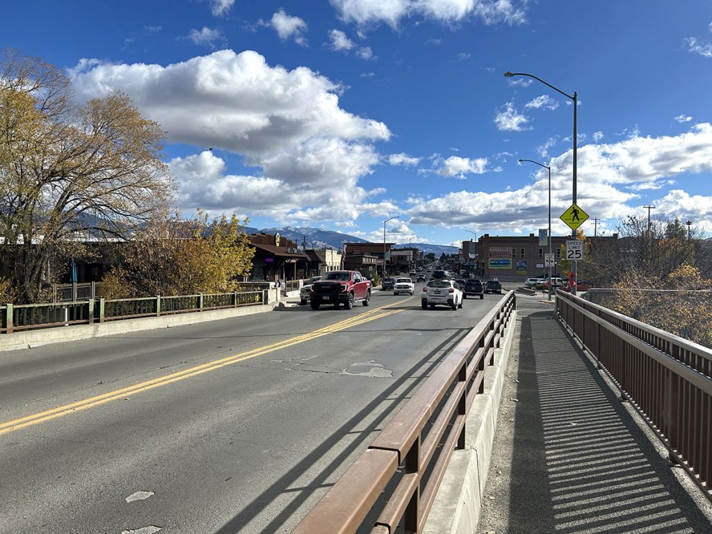US-93 bridge and traffic over the Salmon River facing east looking down Main Street of Salmon, Idaho.