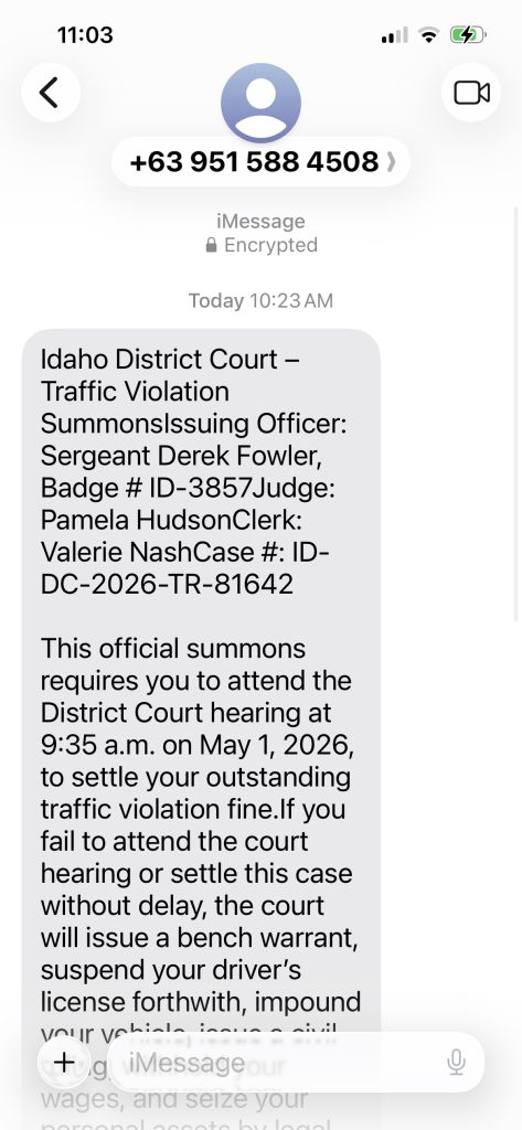 A scam text indicating a traffic violation requires the receiver to attend a hearing.