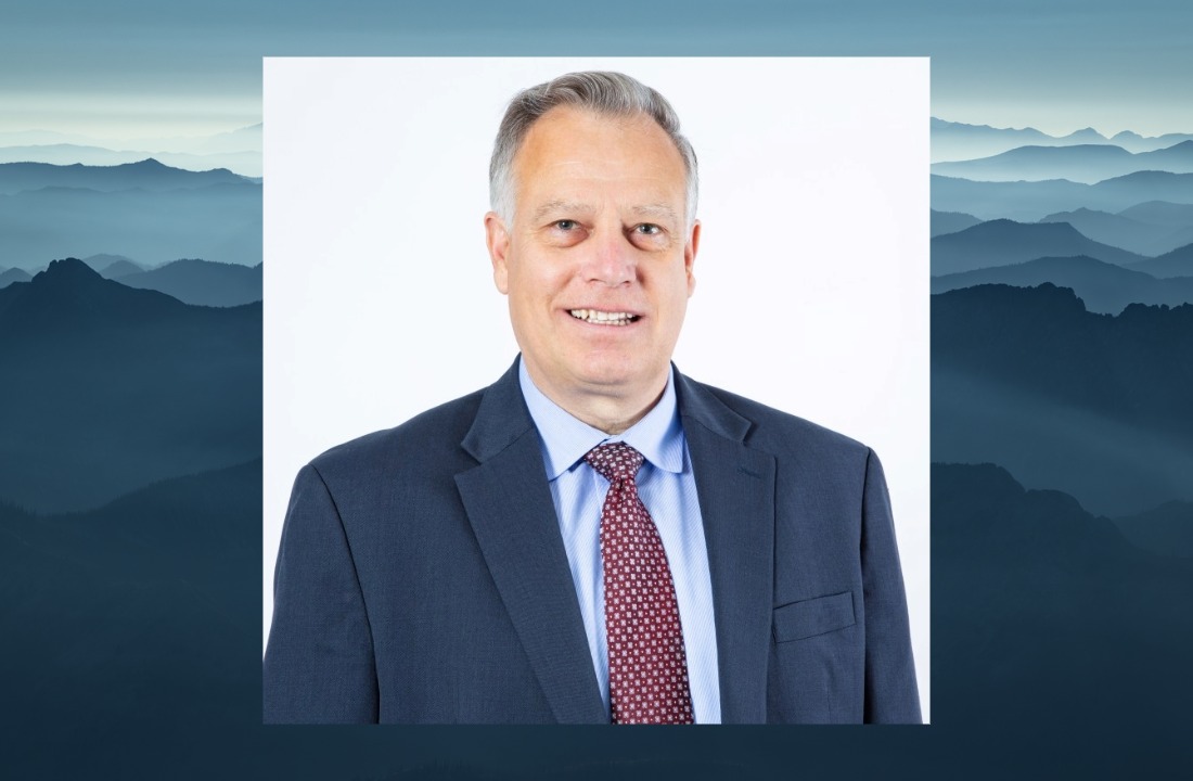 ITD Director Scott Stokes headshot over a scenic image of Idaho mountains and the ITD logo in the corner.