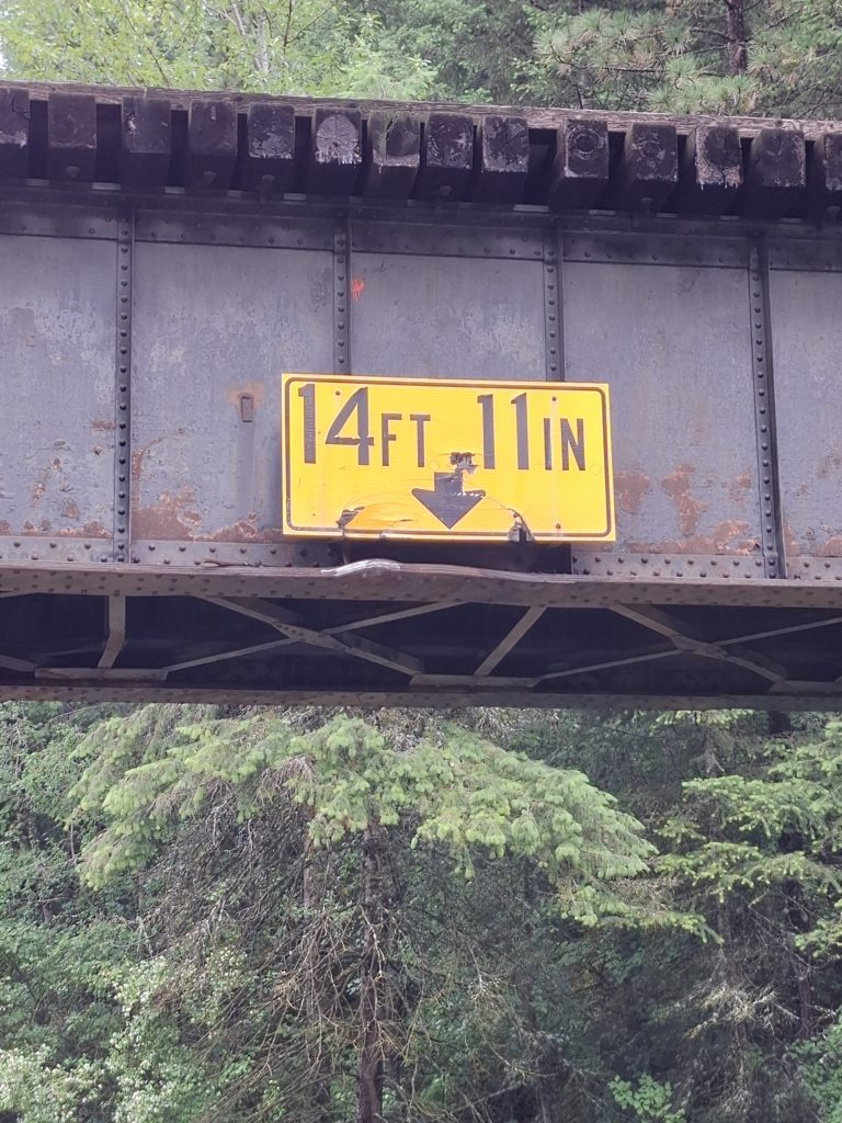 Lapwai Creek railroad bridge over U.S. Highway 95 showing its 14-foot-11-inch vertical clearance after the bridge was struck by an overheight vehicle.