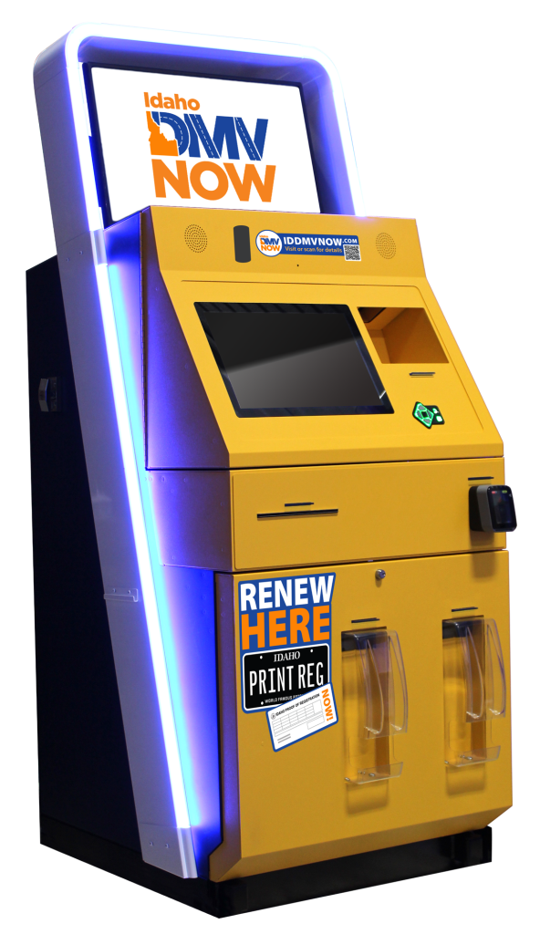Idaho DMV self‑service kiosk with a large “DMV NOW” screen, touchscreen interface, card reader, and printer slots on a yellow and blue machine used for renewing and printing vehicle registrations.