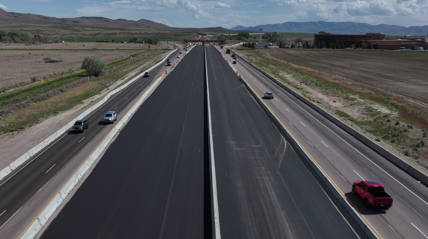 Aerial view of I-15 showing new lanes next to old lanes.