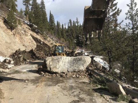 This boulder was buried within one of the larger slides. Travel lanes are twelve feet wide.