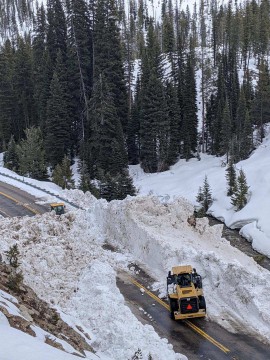 Crews make good headway clearing a path through this avalanche slide.