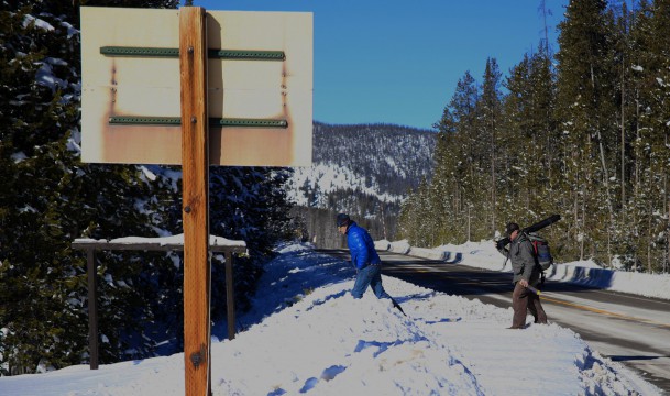 Members of the Avalanche Crew walk to the weather station at Banner Summit Man walking in snow